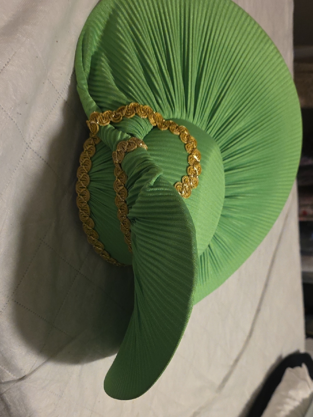 Elegant Green Pleated Statement Hat with Gold Trim
